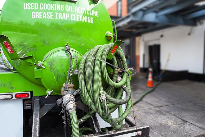 licensed technician pumping a grease trap in Belton